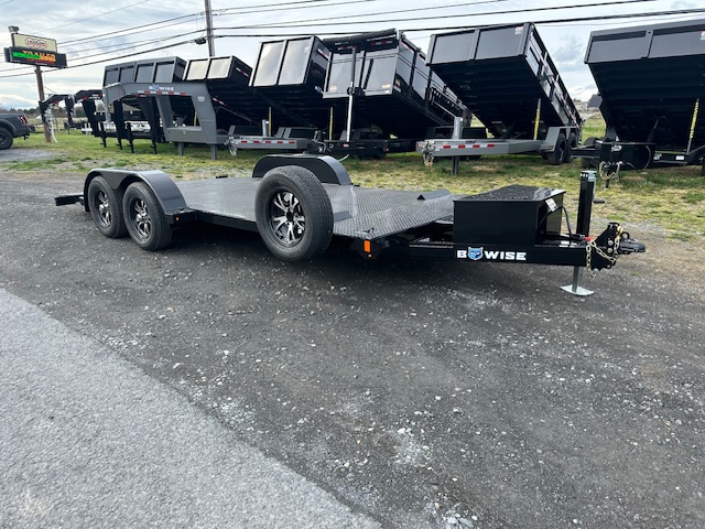 an open car trailer with power tilt, steel deck, and aluminum wheels