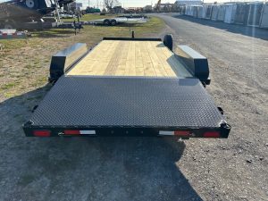 a CAM Superline open car trailer with a wood deck and aluminum wheels