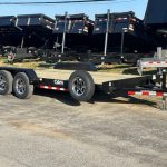 a CAM Superline trailer parked next to a row of dump trailers