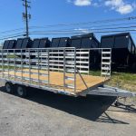 An Alcom silver trailer with a wooden deck