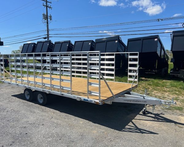 An Alcom silver trailer with a wooden deck