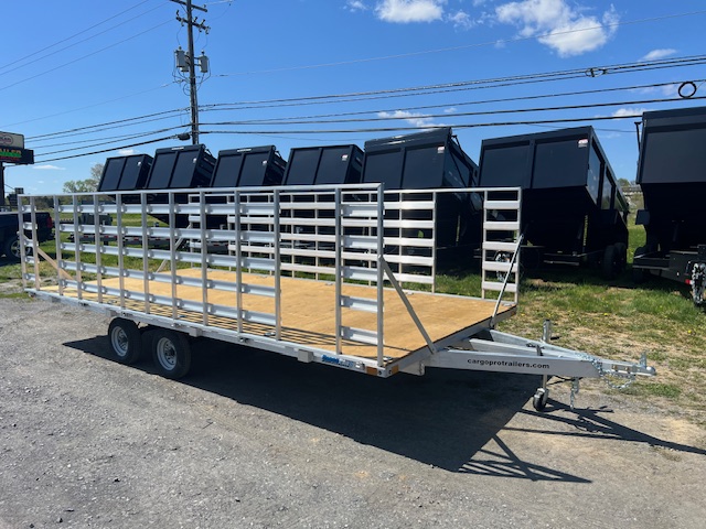 An Alcom silver trailer with a wooden deck