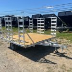 an alcom silver trailer with a wooden deck