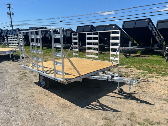an alcom silver trailer with a wooden deck