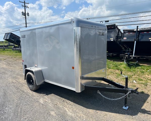 a silver trailer parked