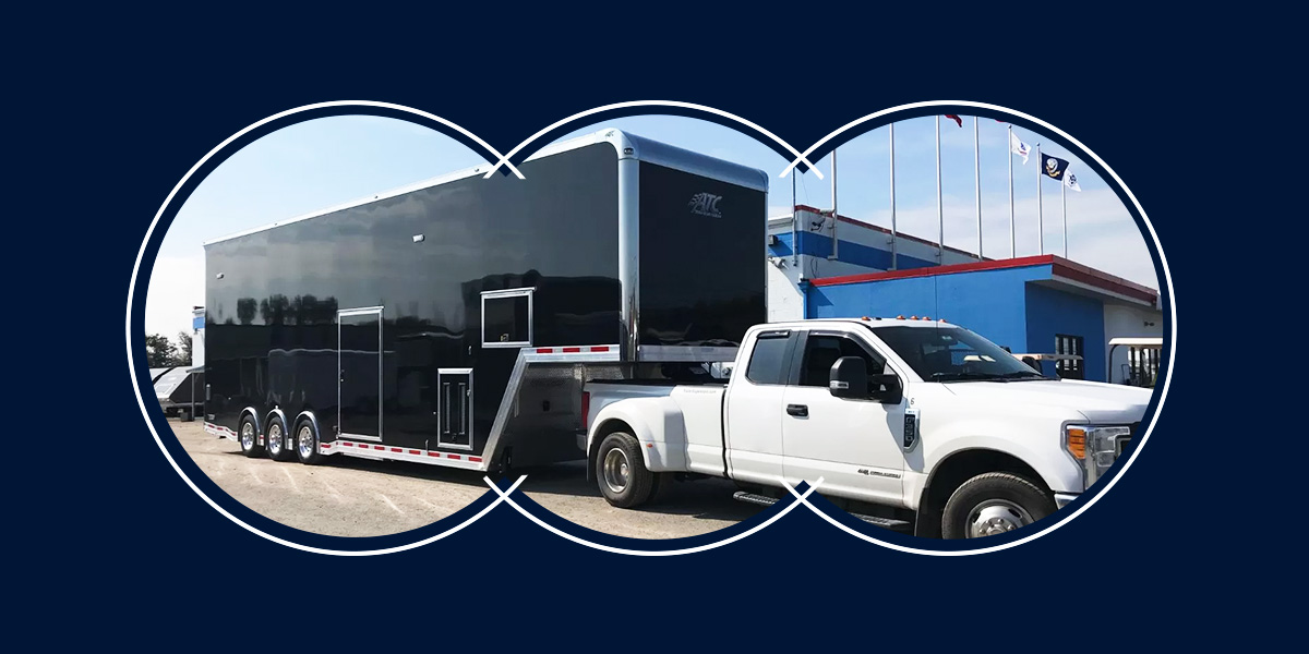 A white pickup truck with a large trailer