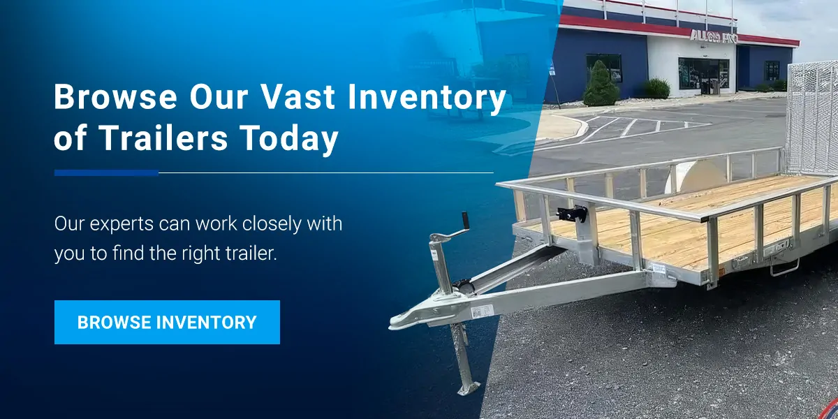An aluminum utility trailer on pavement